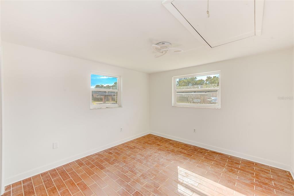 4308 Summersun Drive New Port Richey, FL 34652 - Photo 21 of 42 a view of empty room with wooden floor