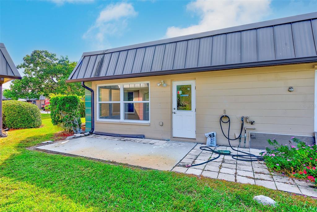 4308 Summersun Drive New Port Richey, FL 34652 - Photo 26 of 42 a view of a chair and table in backyard of the house