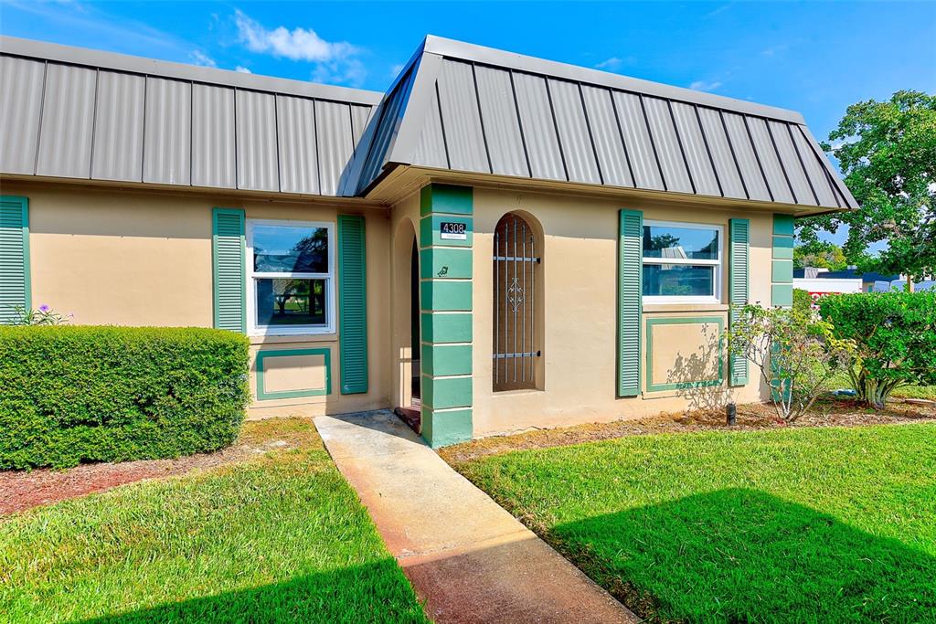 4308 Summersun Drive New Port Richey, FL 34652 - Photo 3 of 42 a view of a house with a yard