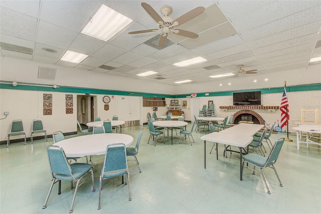 4308 Summersun Drive New Port Richey, FL 34652 - Photo 34 of 42 a dining room with furniture and a chandelier