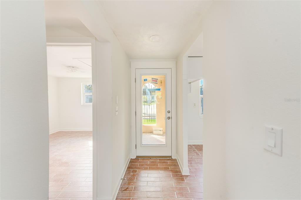 4308 Summersun Drive New Port Richey, FL 34652 - Photo 4 of 42 a view of a hallway with wooden floor and closet