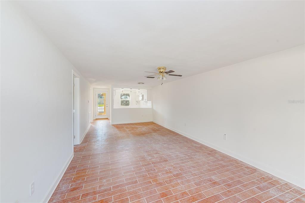 4308 Summersun Drive New Port Richey, FL 34652 - Photo 9 of 42 a view of a hallway with wooden floor and a bathroom