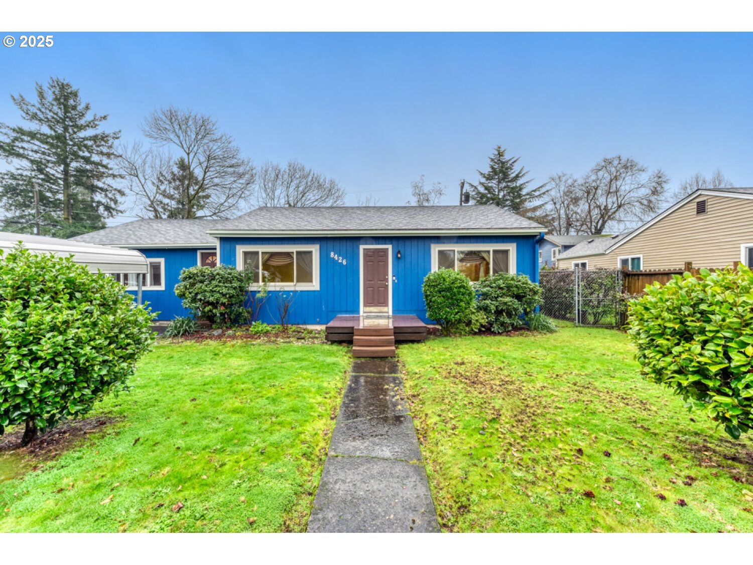 a front view of a house with a yard