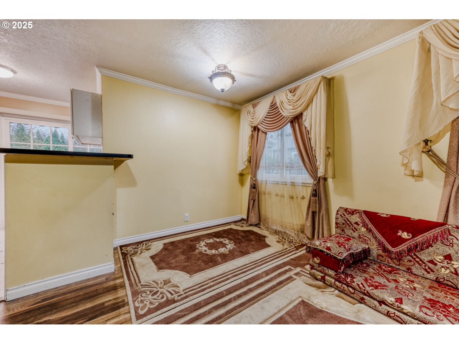 8426 Northeast Wygant Street Portland, OR 97220 - Photo 5 of 17 a room with a stove and a table