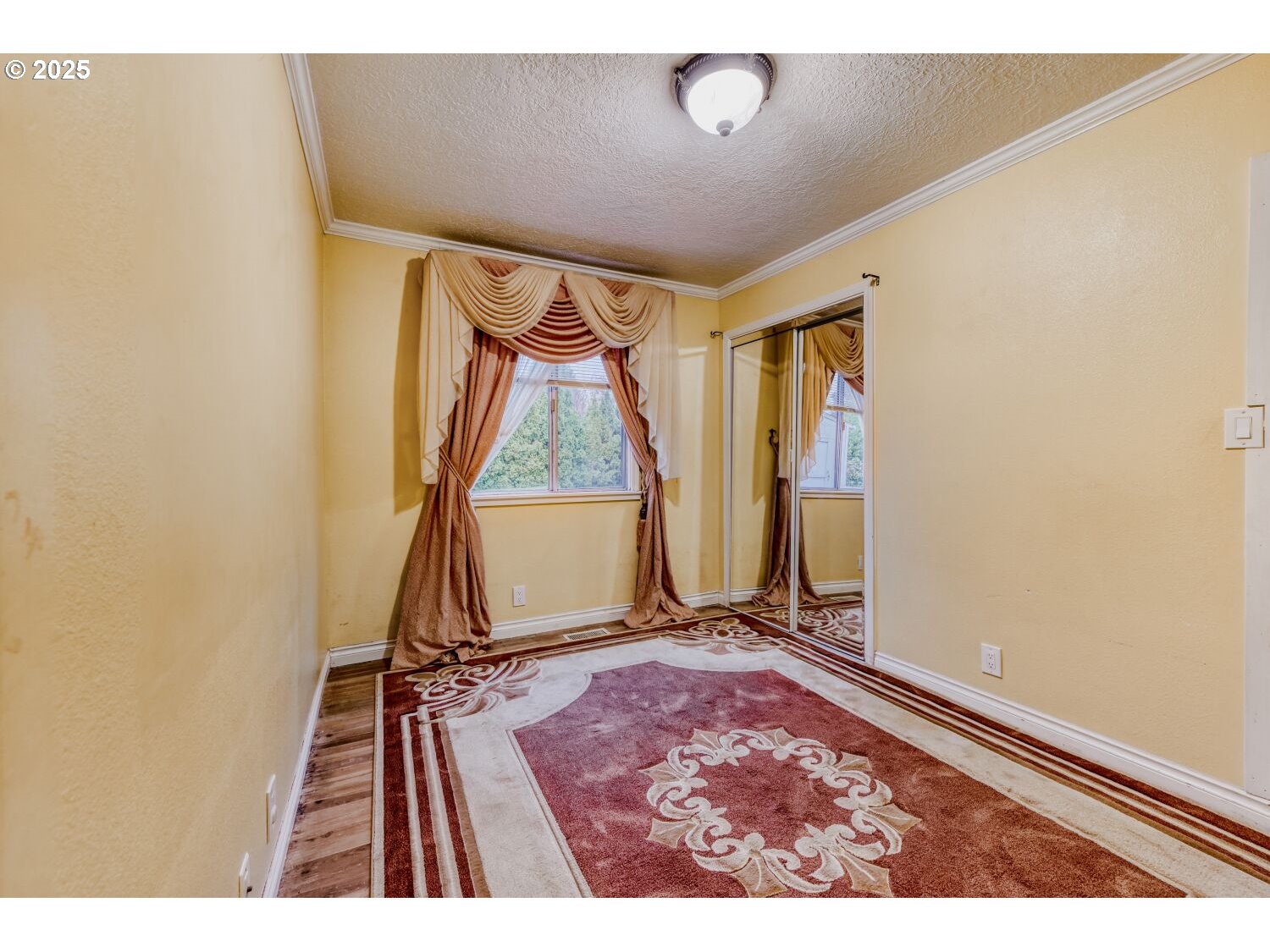 8426 Northeast Wygant Street Portland, OR 97220 - Photo 10 of 17 a view of a room with wooden floor and a window