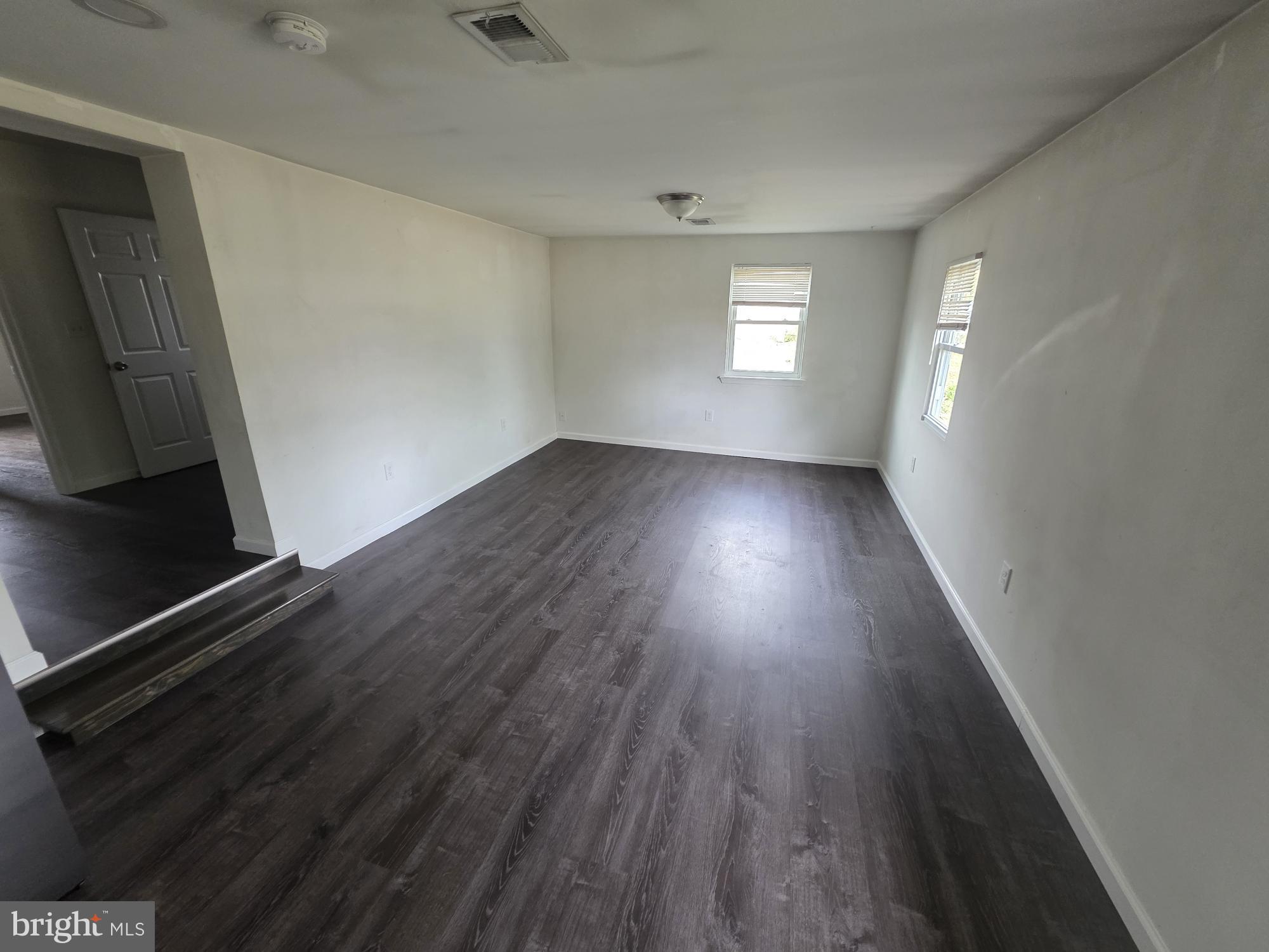 203 East Cedarville Road Pottstown, PA 19465 - Photo 13 of 17 a view of an empty room with wooden floor and a window