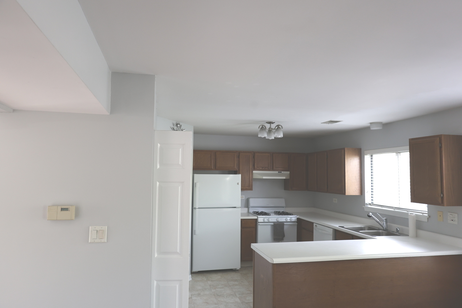 120 North Southport Road Mundelein, IL 60060 - Photo 3 of 10 a kitchen with stainless steel appliances a sink and a refrigerator