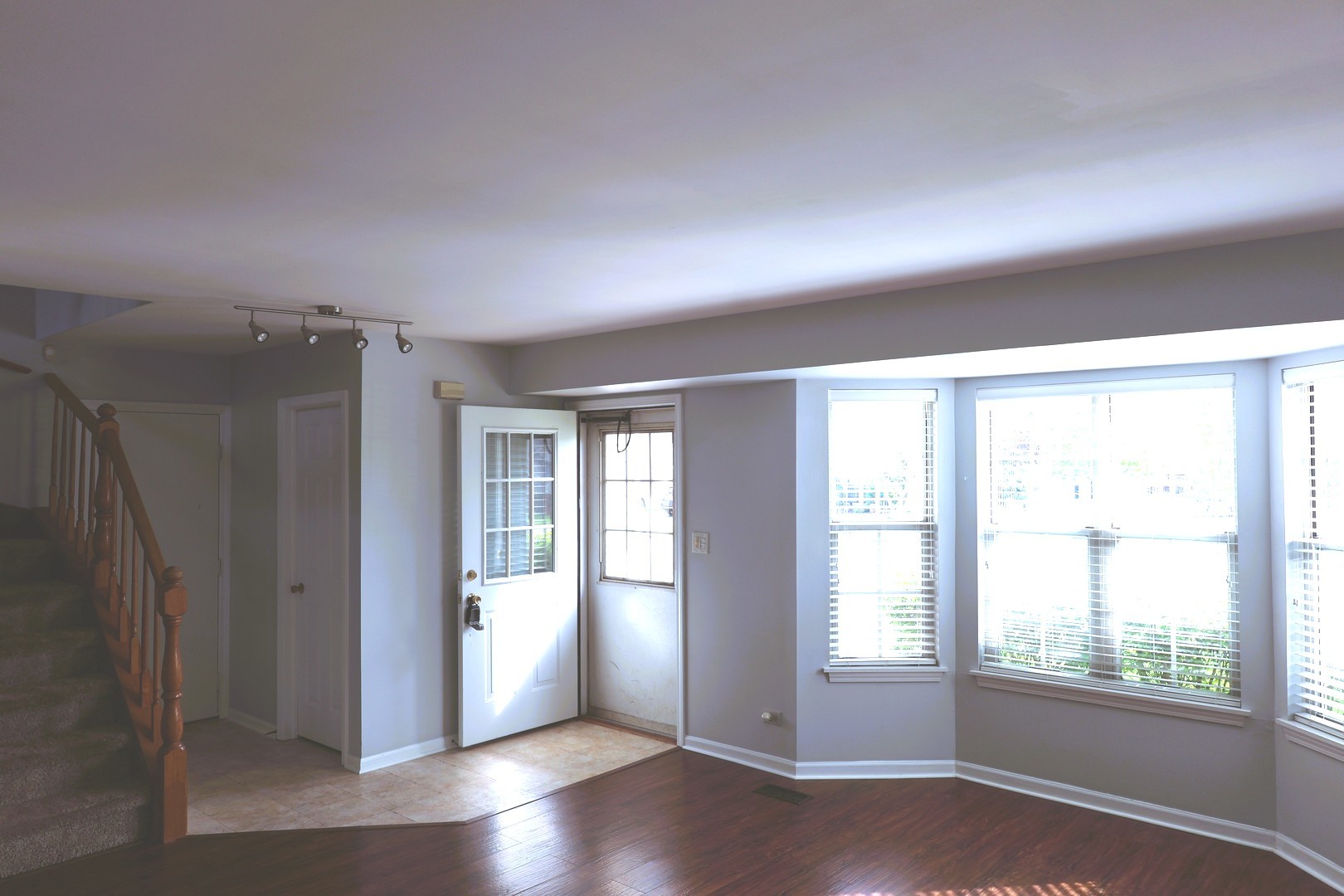 120 North Southport Road Mundelein, IL 60060 - Photo 5 of 10 an empty room with wooden floor and windows