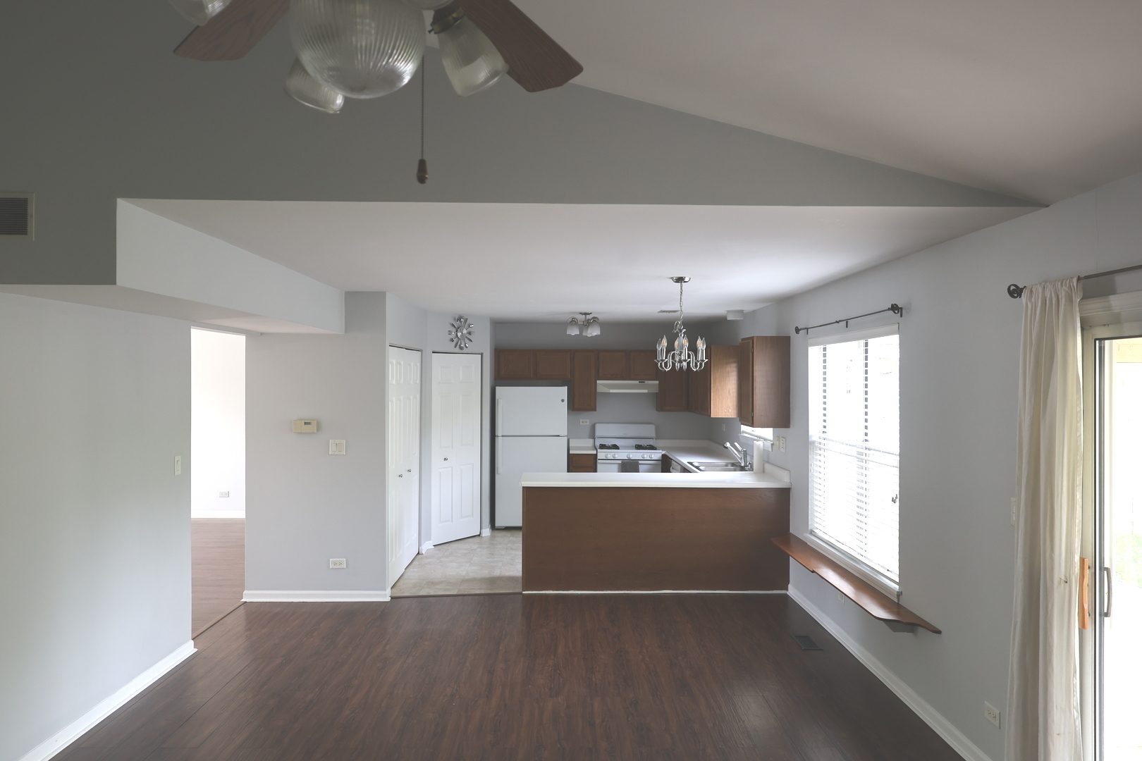 120 North Southport Road Mundelein, IL 60060 - Photo 8 of 10 a view of a kitchen with a sink dishwasher and a fireplace