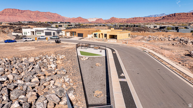 2761 West Lava Hls Road Santa Clara, UT 84765 - Photo 29 of 53 View of asphalt road with a mountain view, a residential view, and curbs