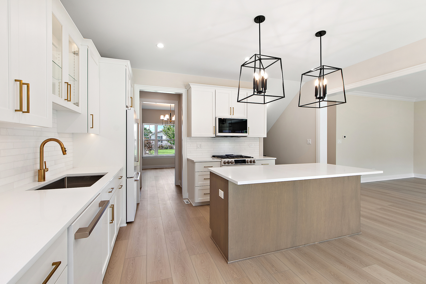 700 Czacki Street Lemont, IL 60439 - Photo 12 of 30 a kitchen with stainless steel appliances a stove a sink dishwasher a refrigerator and white cabinets with wooden floor