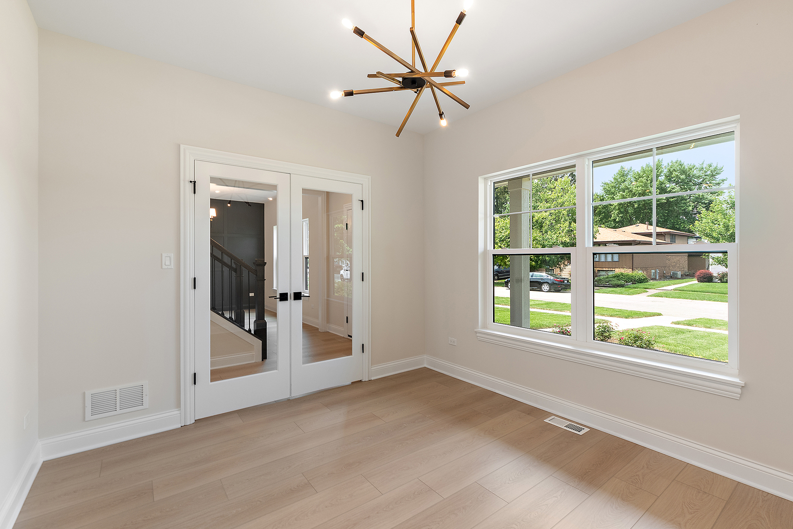 700 Czacki Street Lemont, IL 60439 - Photo 7 of 30 a view of a livingroom with a ceiling fan and window