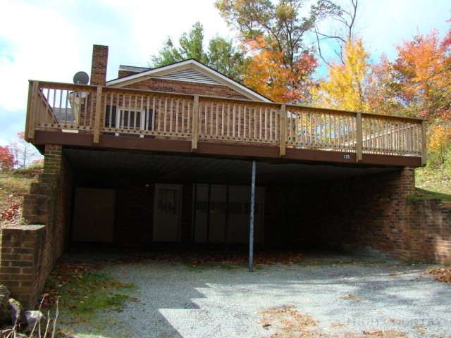 135 Ivy Ridge Road Deep Gap, NC 28618 - Photo 15 of 16 a view of a house with a balcony