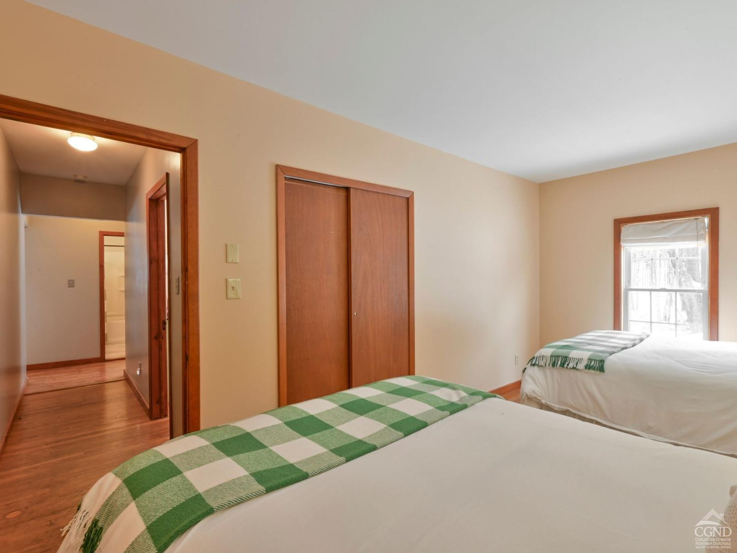 110 Maplecrest Road Windham, NY 12439 - Photo 27 of 73 a bedroom with a bed and wooden floor