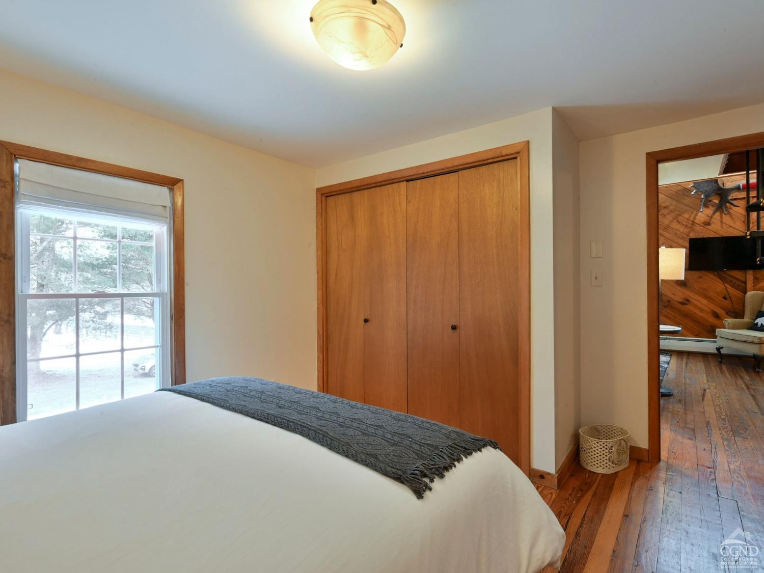 110 Maplecrest Road Windham, NY 12439 - Photo 44 of 73 a bedroom with a bed and wooden floor