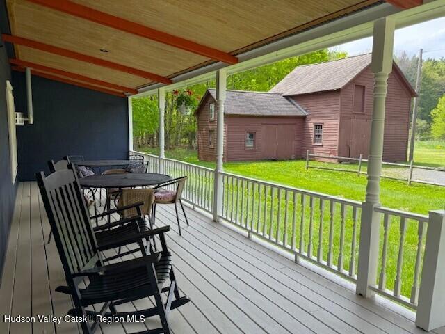 110 Maplecrest Road Windham, NY 12439 - Photo 5 of 73 a view of a wooden chairs and table in the balcony