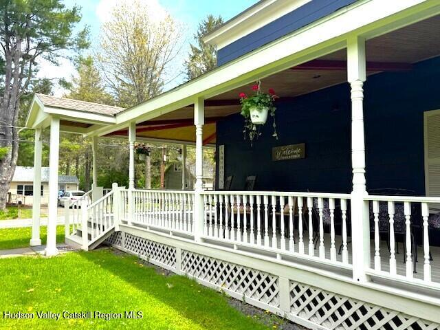 110 Maplecrest Road Windham, NY 12439 - Photo 6 of 73 a view of a chair and table in the porch