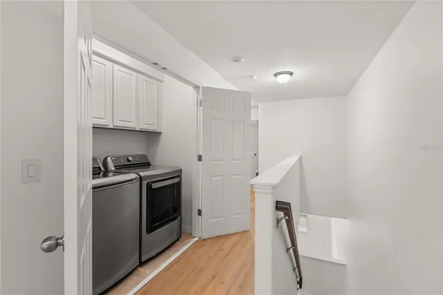 a kitchen with a stove top oven and cabinets