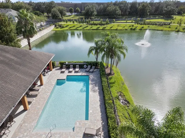 an aerial view of a house with a lake view