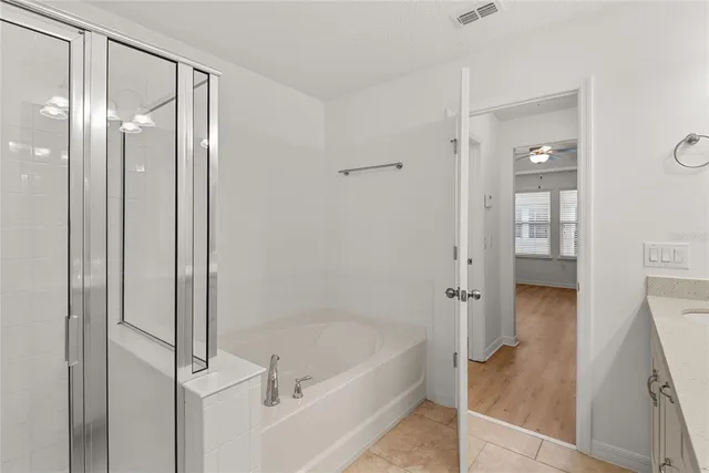 a bathroom with a bathtub and a shower