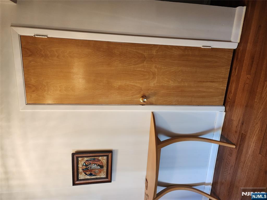 911-921 Teaneck Road, Unit B1 Teaneck, NJ 07666 - Photo 9 of 12 a view of a small space with wooden floor and a ceiling fan