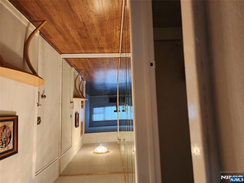 911-921 Teaneck Road, Unit B1 Teaneck, NJ 07666 - Photo 10 of 12 a view of a hallway with wooden floor and furniture