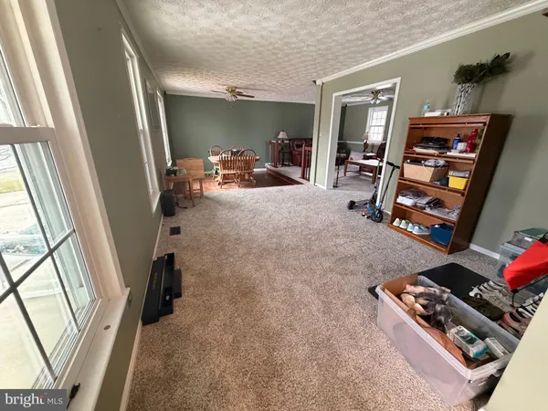 a room with furniture and a flat screen tv