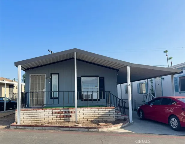 a view of a car parked front of a house