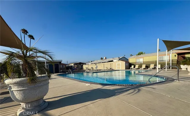 a view of a patio with swimming pool