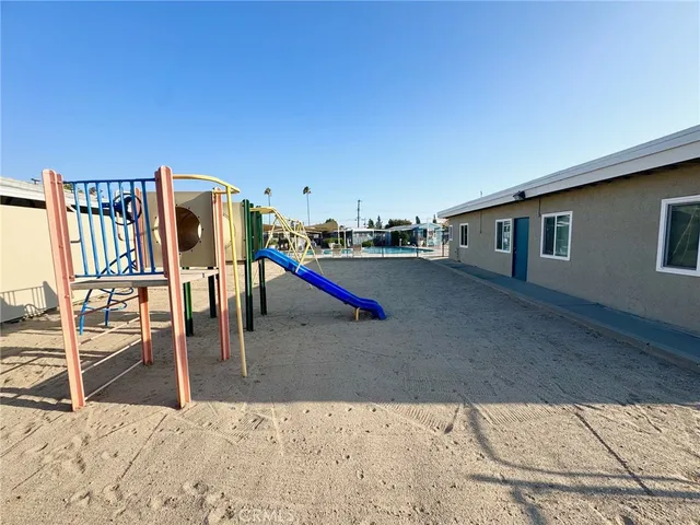a view of a living room and kitchen