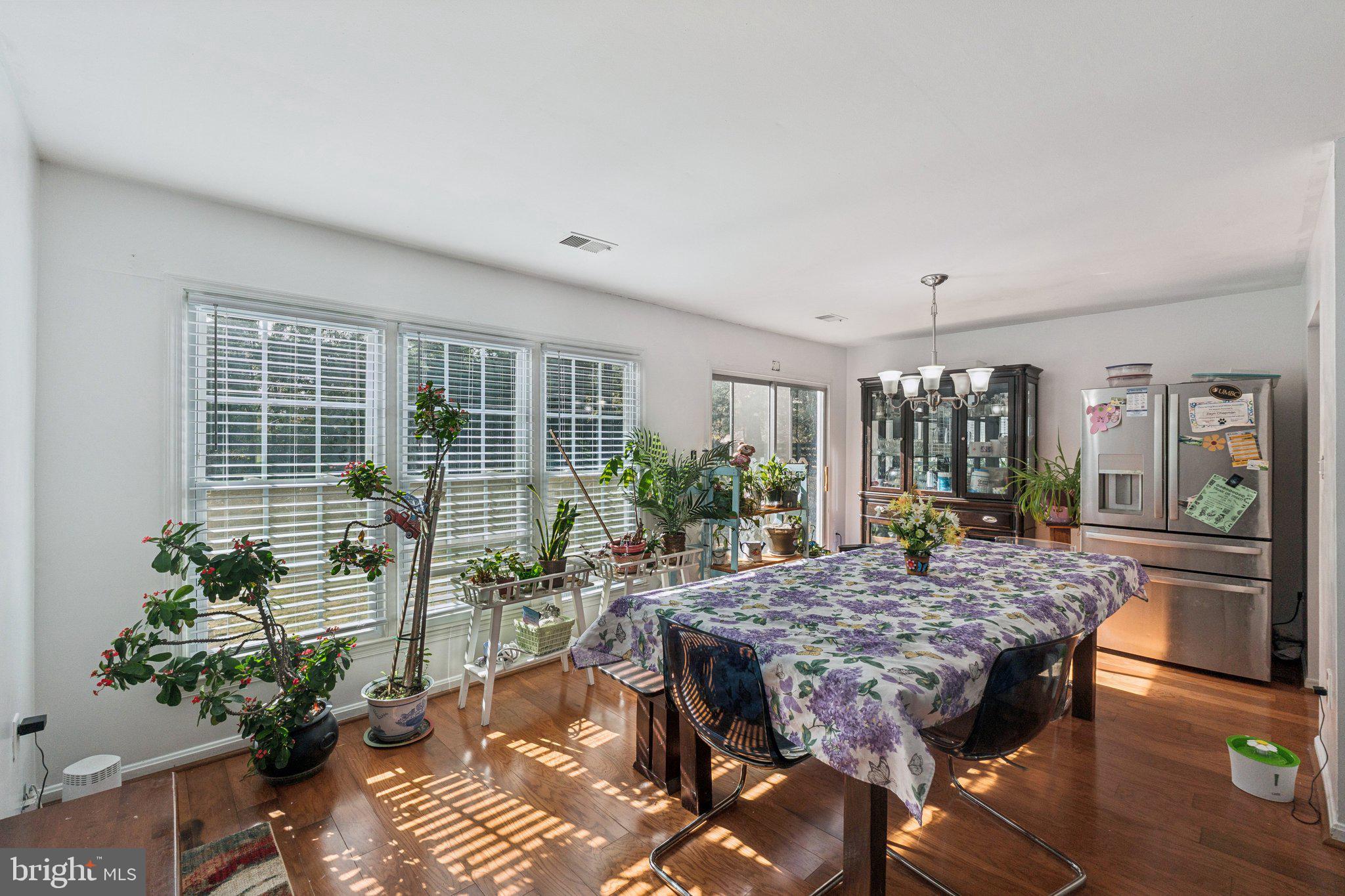 8124 Seneca View Drive Gaithersburg, MD 20882 - Photo 14 of 37 a outdoor dining space with furniture and wooden floor