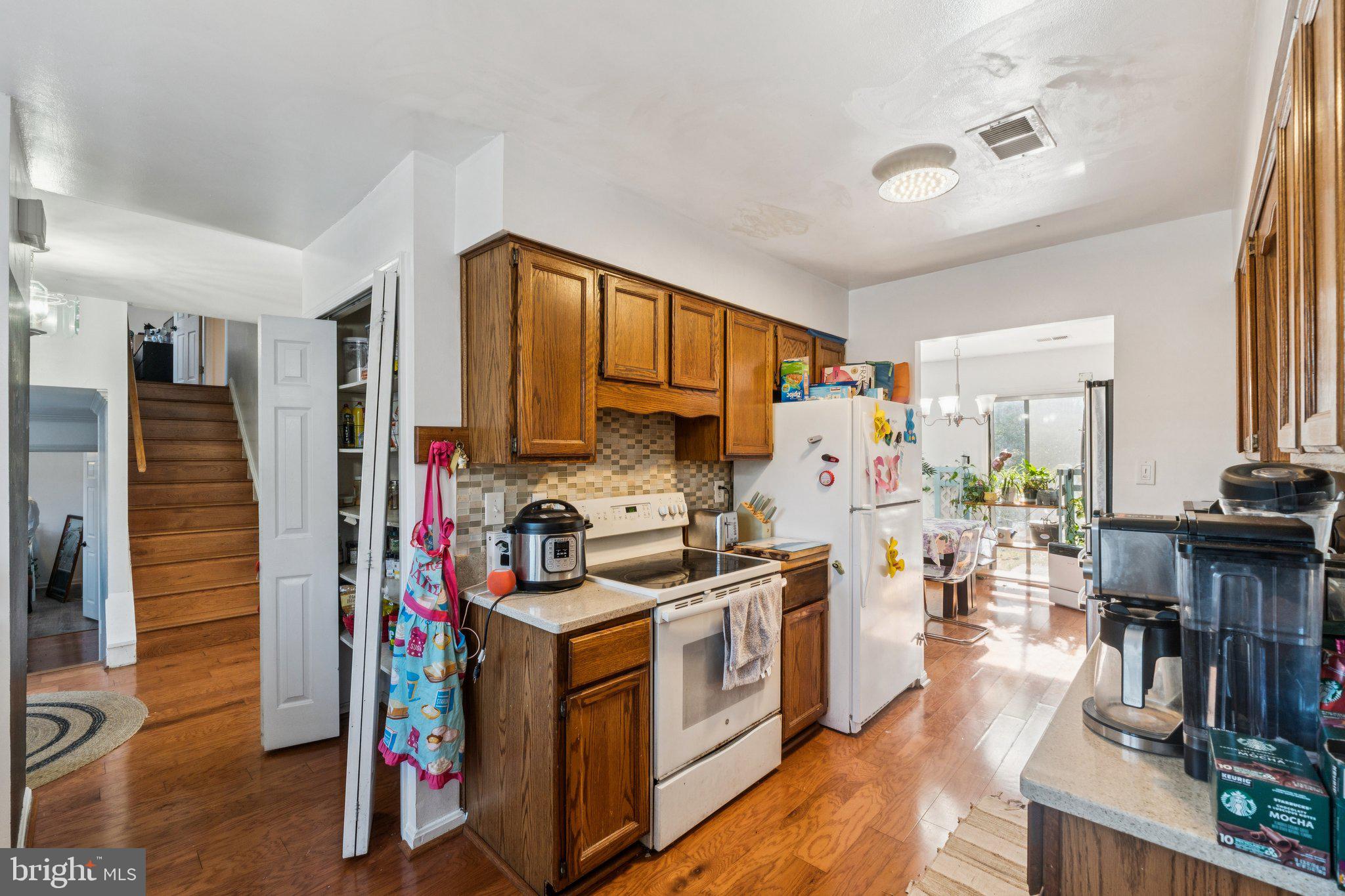 8124 Seneca View Drive Gaithersburg, MD 20882 - Photo 20 of 37 a view of living room kitchen with furniture and wooden floor