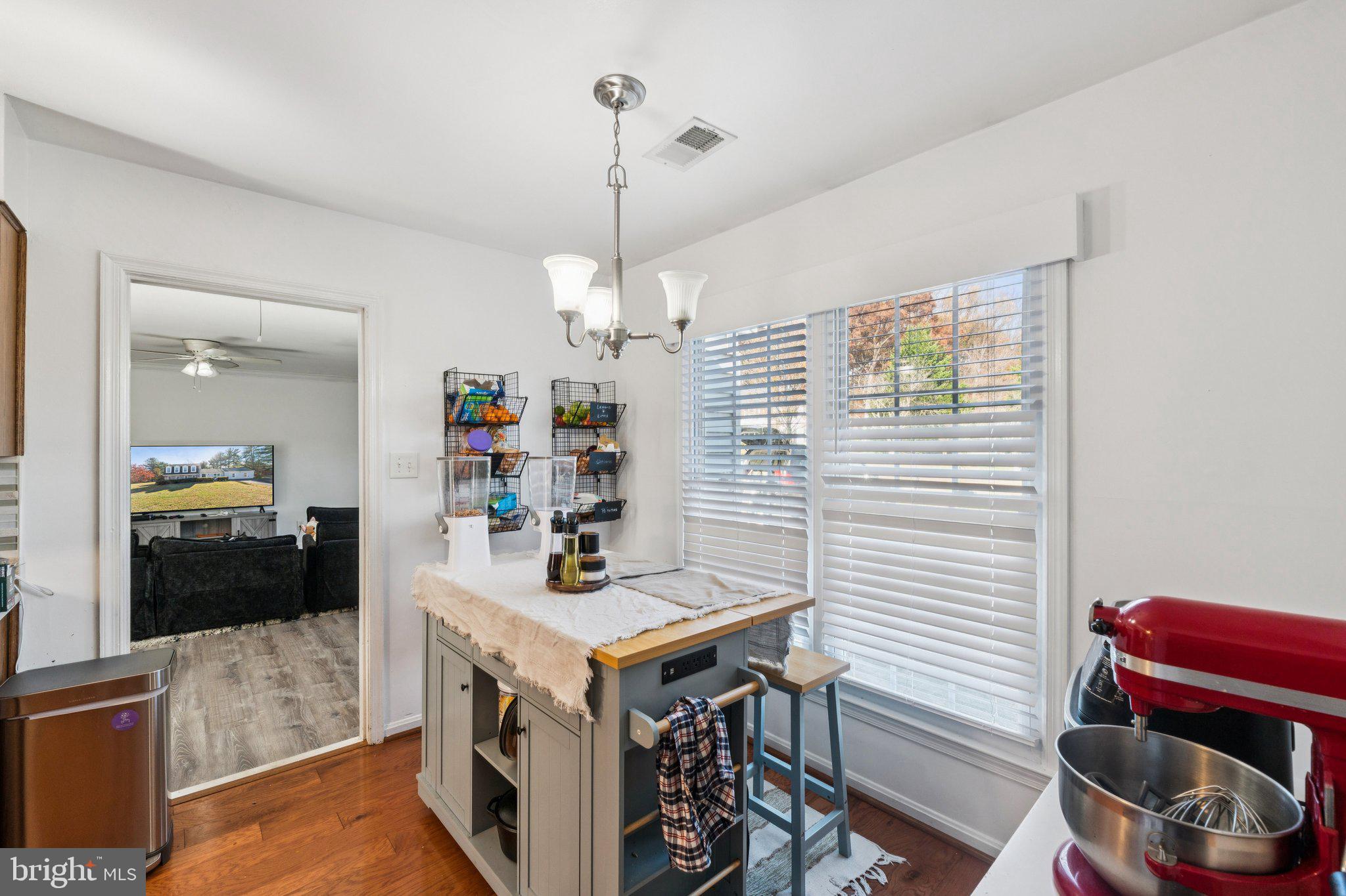 8124 Seneca View Drive Gaithersburg, MD 20882 - Photo 21 of 37 a kitchen that has a table and chairs in it
