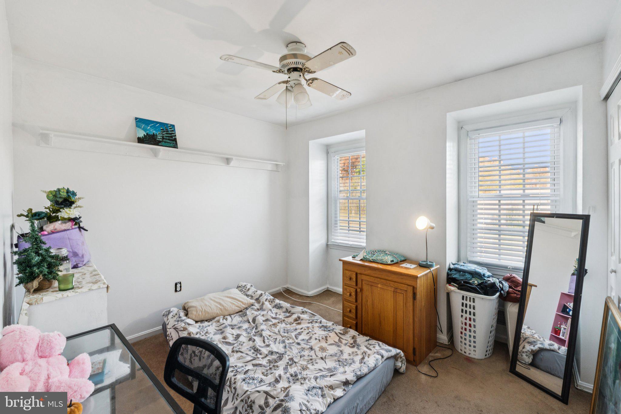 8124 Seneca View Drive Gaithersburg, MD 20882 - Photo 25 of 37 a bedroom with a bed and a chandelier