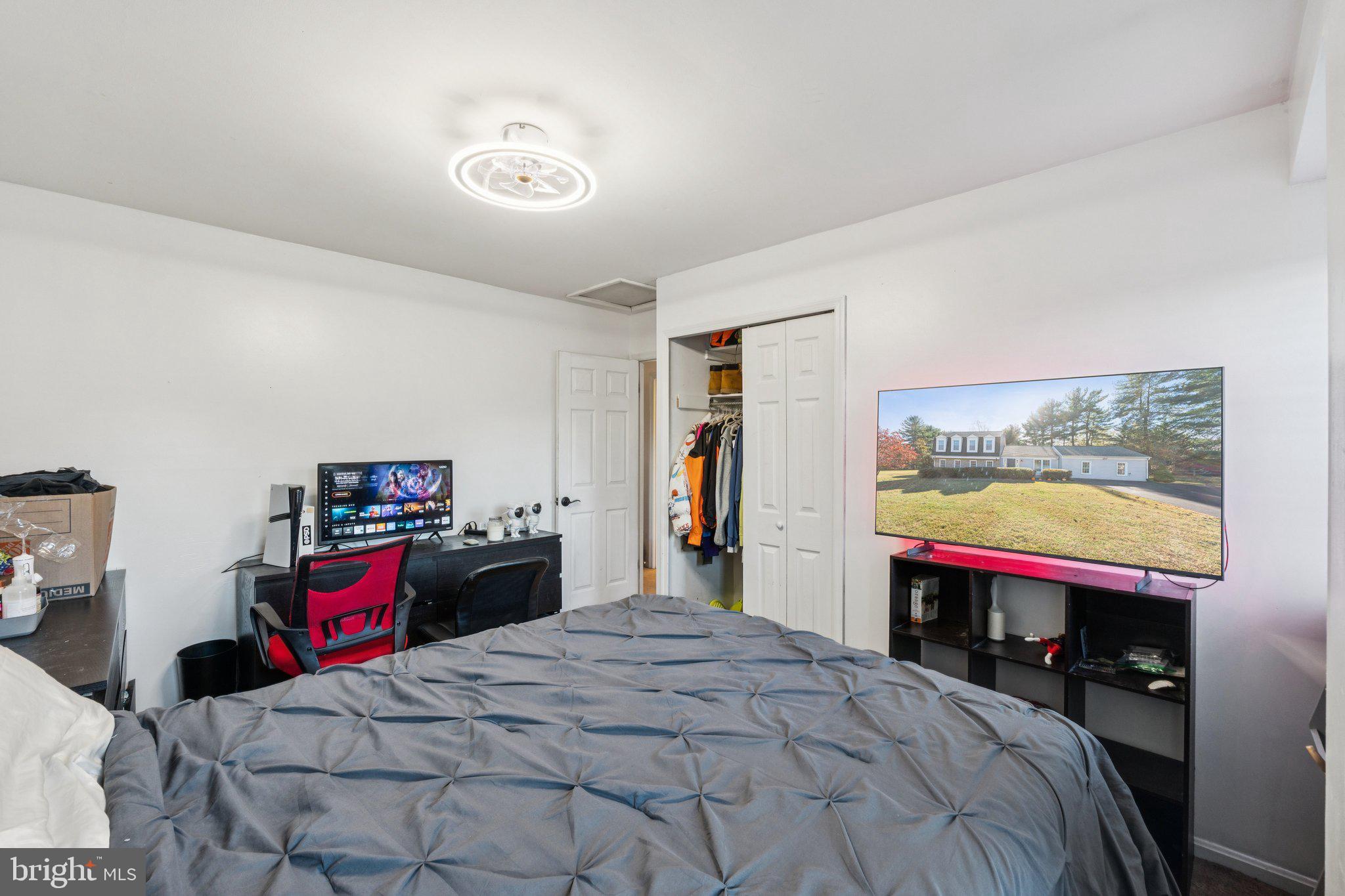 8124 Seneca View Drive Gaithersburg, MD 20882 - Photo 28 of 37 a bedroom with a bed and a large window