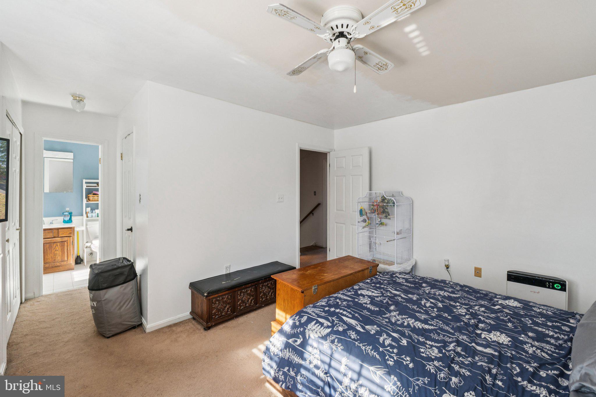 8124 Seneca View Drive Gaithersburg, MD 20882 - Photo 31 of 37 a bedroom with a bed and a chandelier