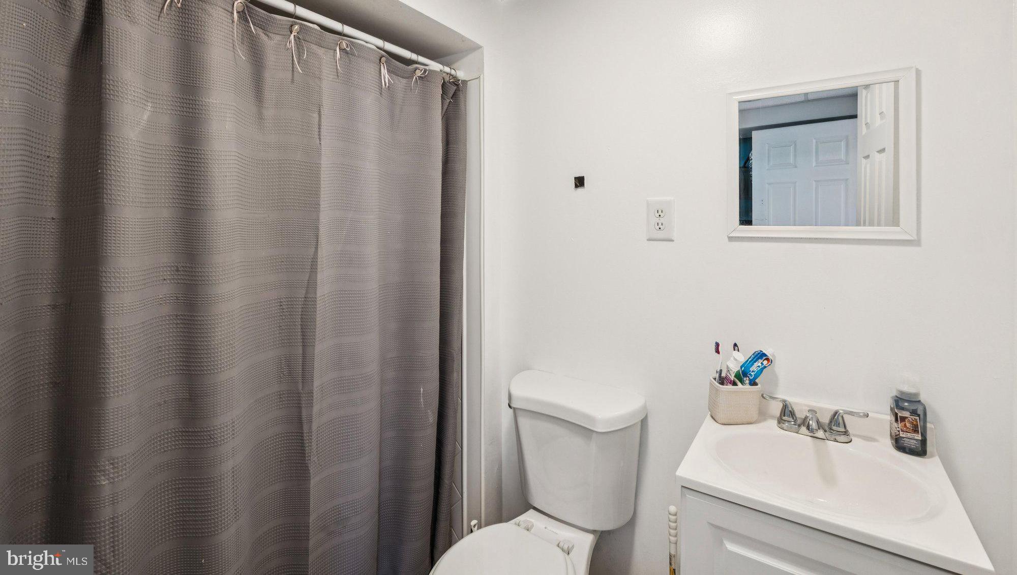 8124 Seneca View Drive Gaithersburg, MD 20882 - Photo 7 of 37 a white toilet sitting next to a bathroom sink