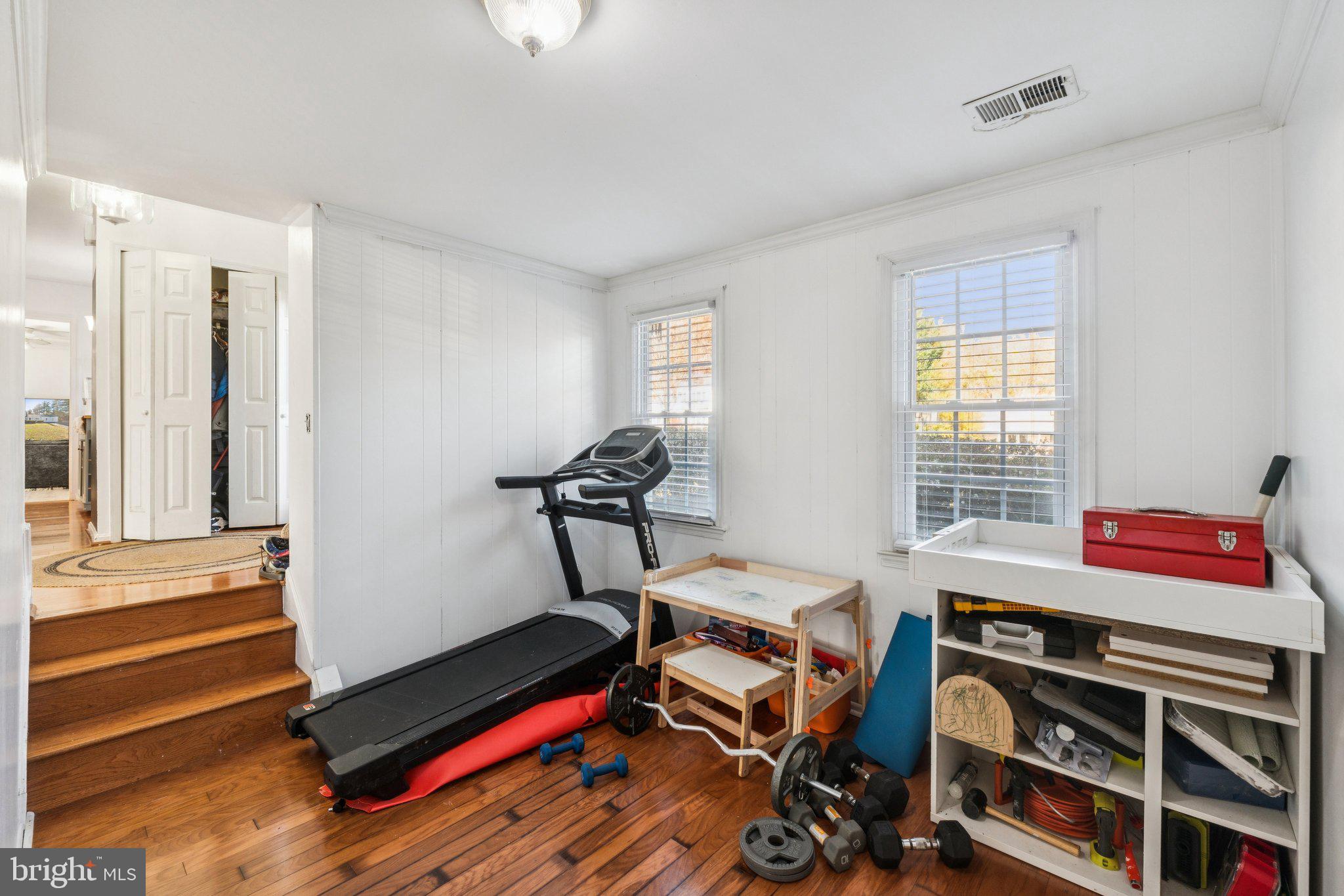 8124 Seneca View Drive Gaithersburg, MD 20882 - Photo 8 of 37 a room with gym equipment and a window