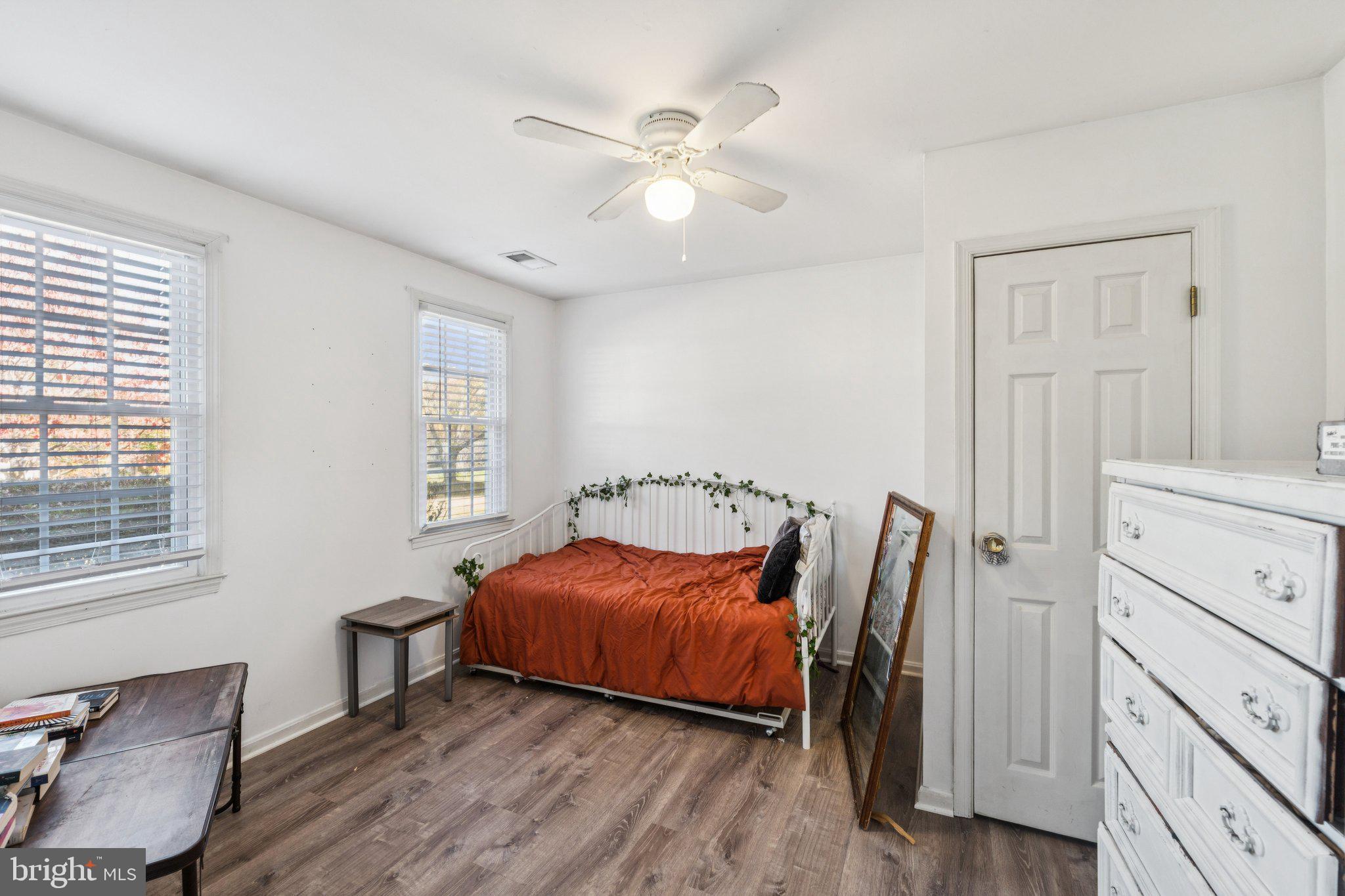 8124 Seneca View Drive Gaithersburg, MD 20882 - Photo 10 of 37 a bedroom with a bed and a table