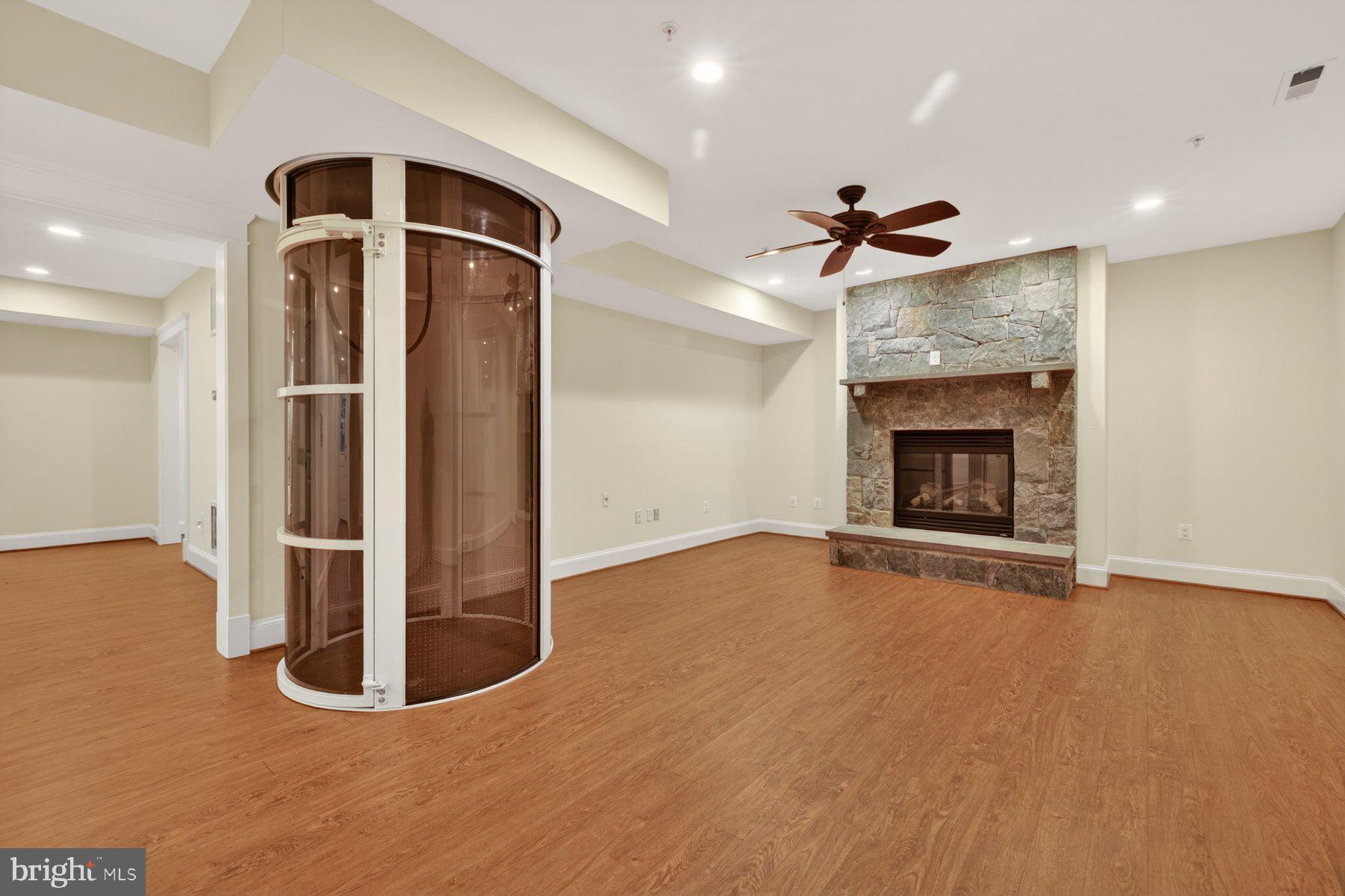 5011 Rugby Avenue Bethesda, MD 20814 - Photo 47 of 63 Basement family room w/gas fireplace and elvevator