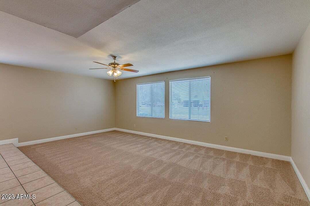 6521 West Camelback Road Phoenix, AZ 85033 - Photo 13 of 32 wooden floor in an empty room with a window