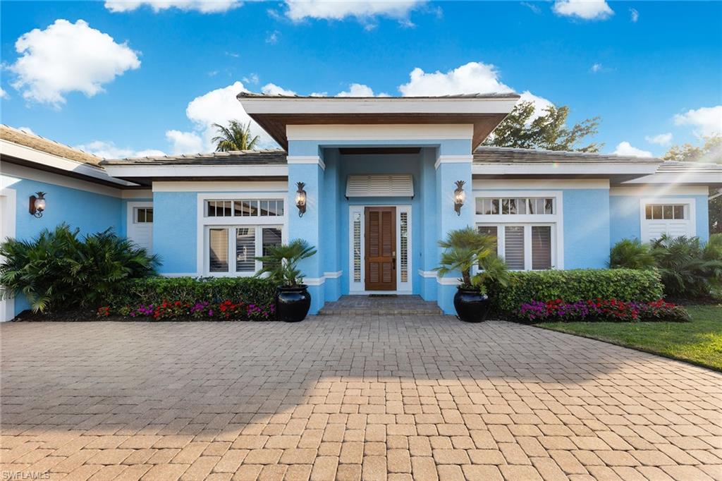 540 Ketch Drive Naples, FL 34103 - Photo 1 of 32 a view of a house with a garden