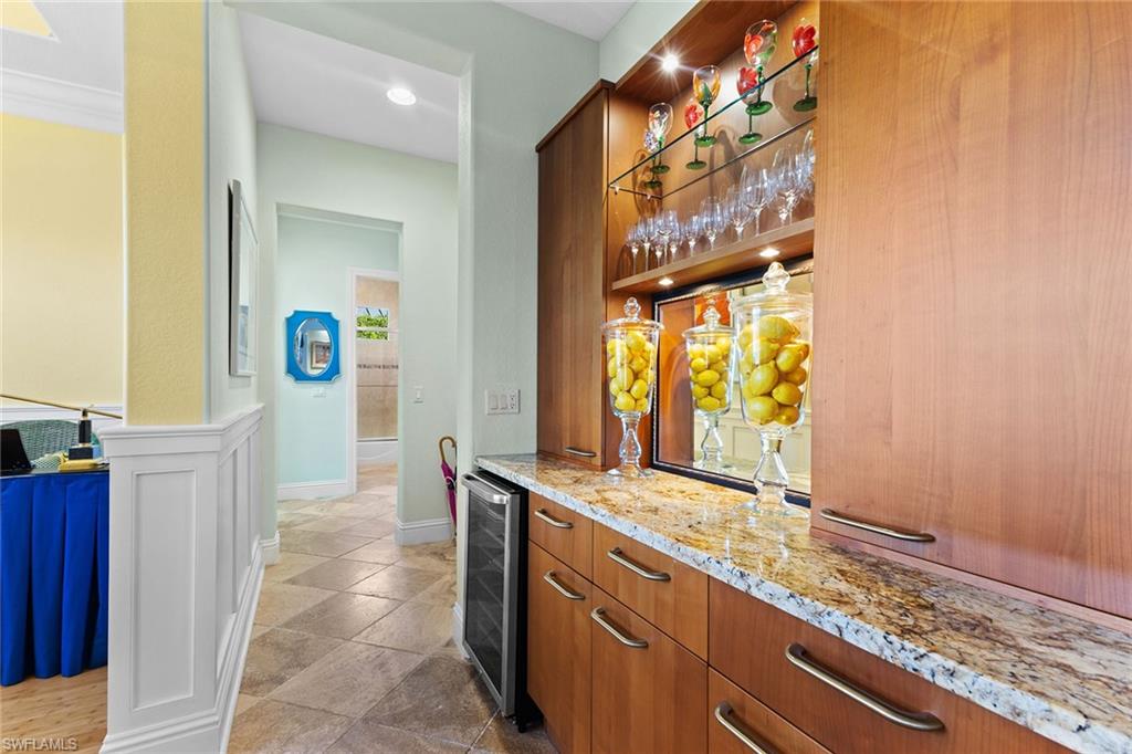 540 Ketch Drive Naples, FL 34103 - Photo 12 of 32 a bathroom with a granite countertop sink and a mirror