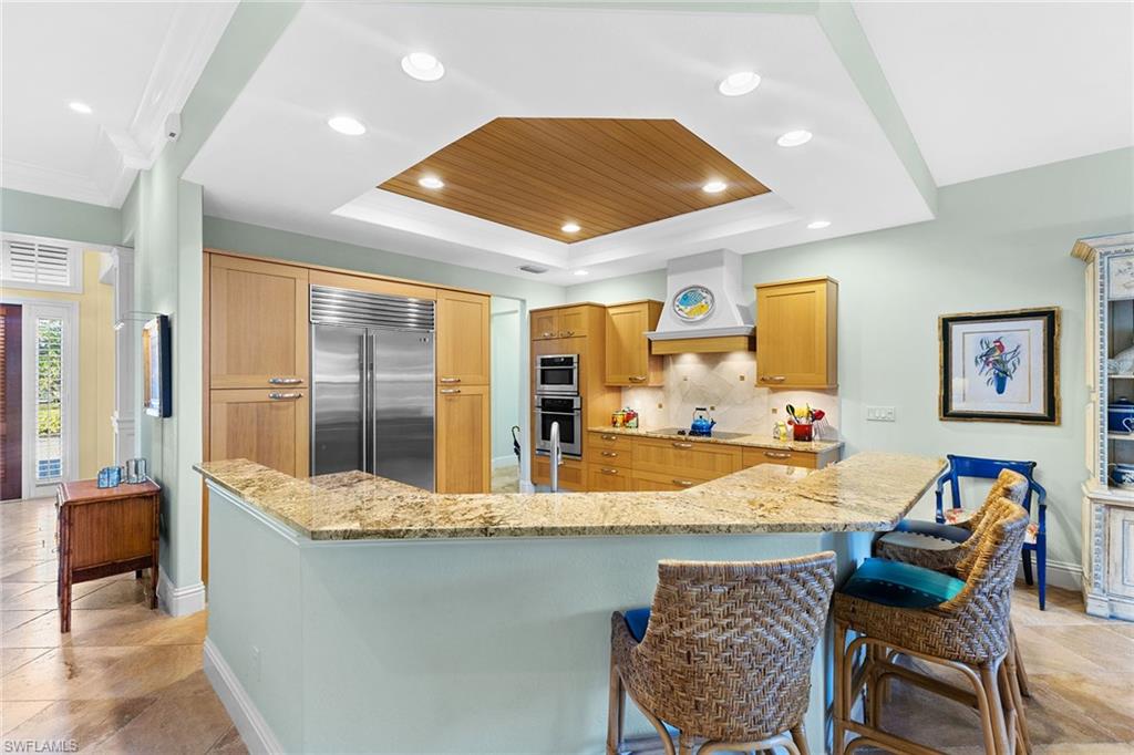 540 Ketch Drive Naples, FL 34103 - Photo 14 of 32 a dining hall with stainless steel appliances granite countertop a sink and a refrigerator