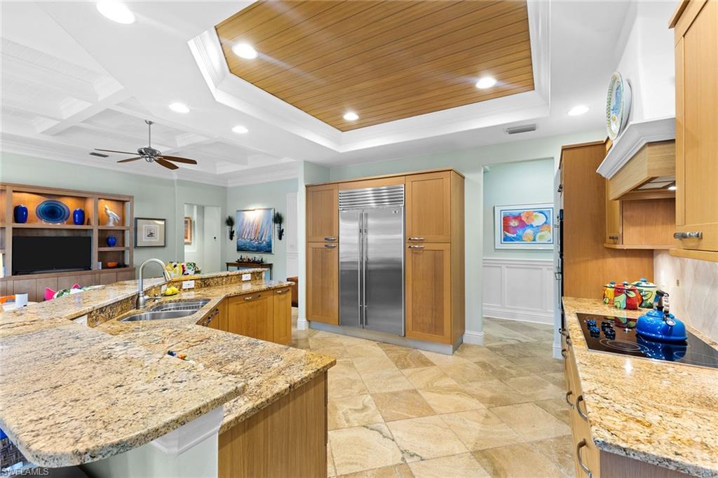 540 Ketch Drive Naples, FL 34103 - Photo 15 of 32 a dining hall with stainless steel appliances granite countertop a sink and cabinets