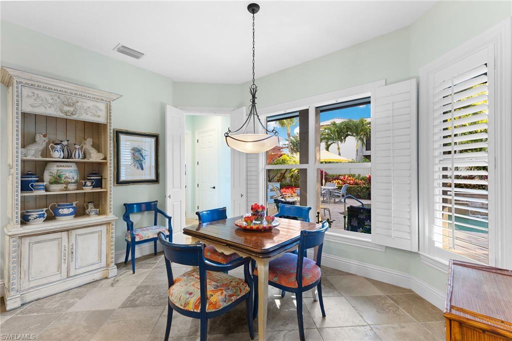 540 Ketch Drive Naples, FL 34103 - Photo 16 of 32 a dining room with furniture and window