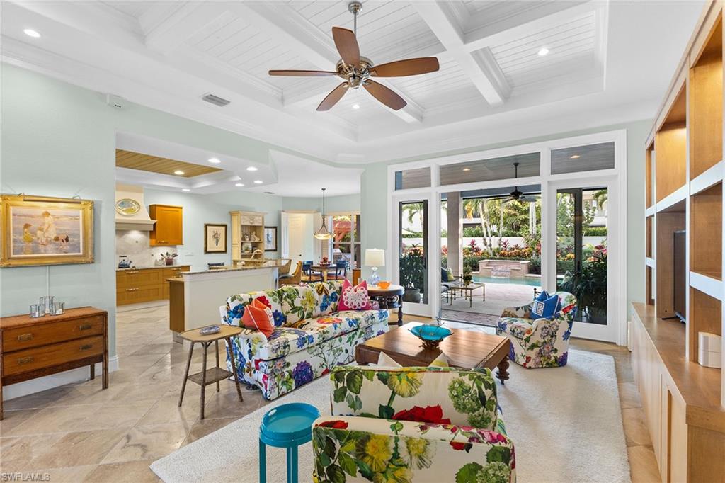 540 Ketch Drive Naples, FL 34103 - Photo 18 of 32 a living room filled with furniture windows and a ceiling fan
