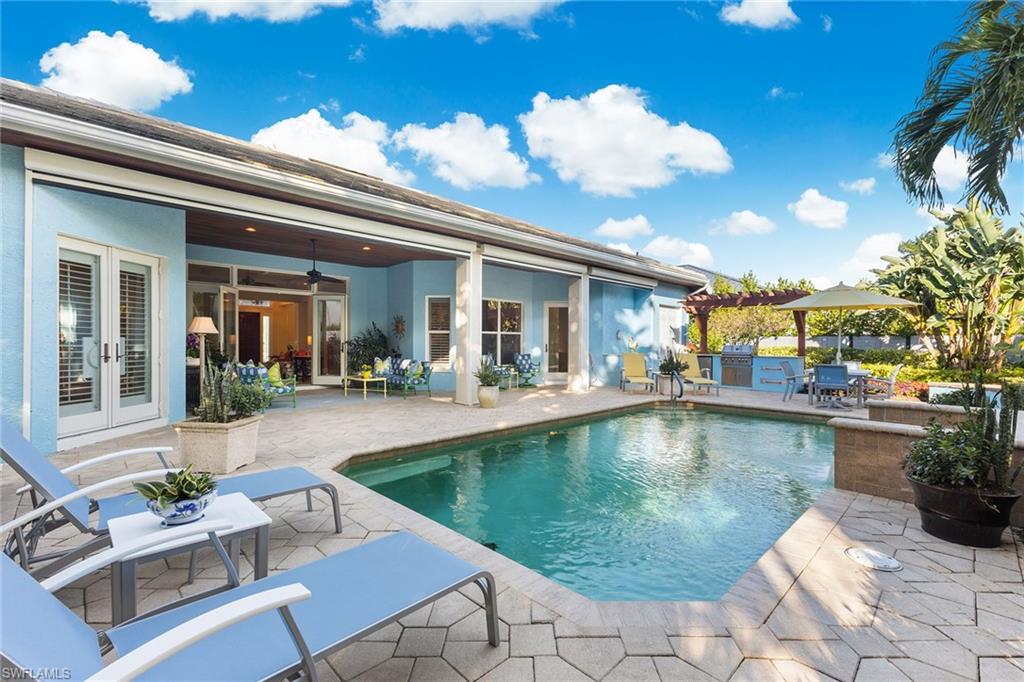 540 Ketch Drive Naples, FL 34103 - Photo 23 of 32 a view of a house with swimming pool and sitting area