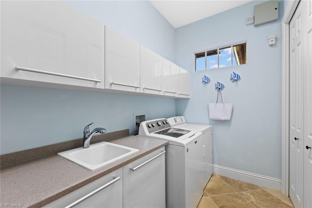 540 Ketch Drive Naples, FL 34103 - Photo 26 of 32 a room with storage and utility