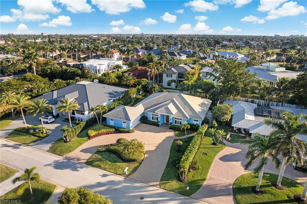 540 Ketch Drive Naples, FL 34103 - Photo 27 of 32 an aerial view of residential houses with outdoor space and parking